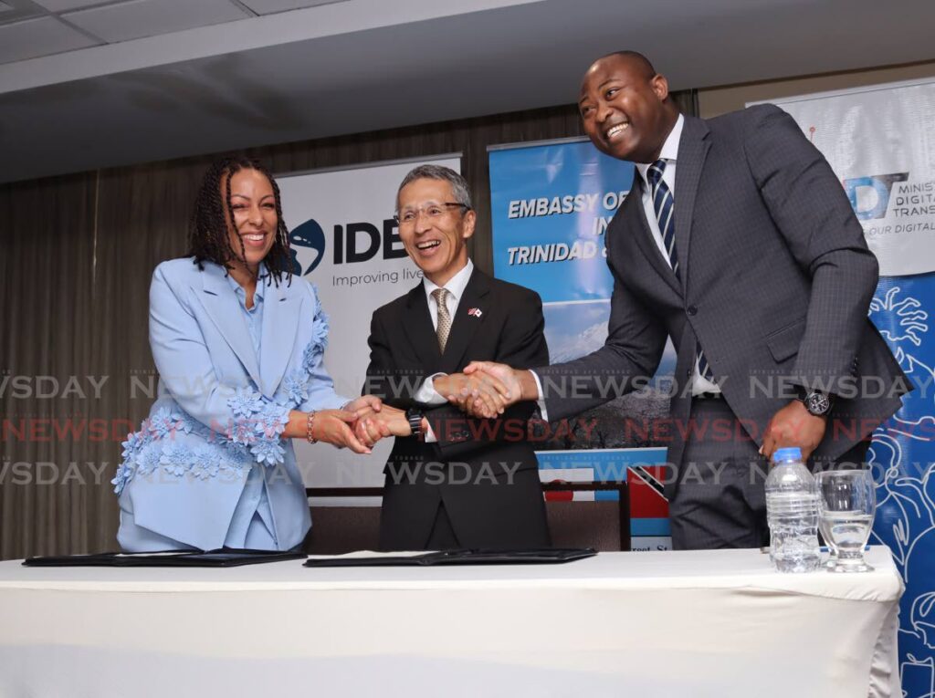 At centre, Yutaka Matsubara, Ambassador of Japan shakes the hands of Caroma Cockburn, IDB Country Representative, left and Cory Belfon, Permanent Secretary of the Ministry of Digital Transformation, right at a media launch of technical corporation at Hilton Hotel and Conference Centre, Port of Spain on September 16, 2024. - Photo by Gabriel Williams