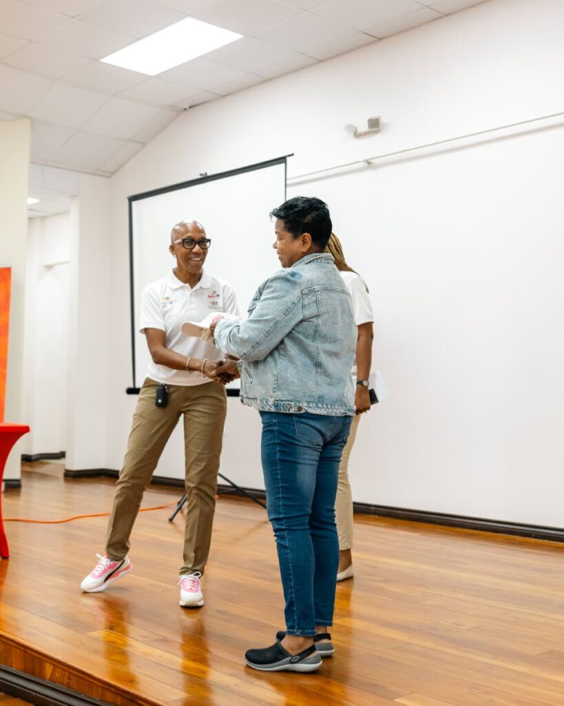 Lyndell Hoyte-Sanchez, Head of Community Sport Unit at SporTT, left, makes a presentation at the ICS Building Internal Structures workshop in Arima.
 - via SporTT