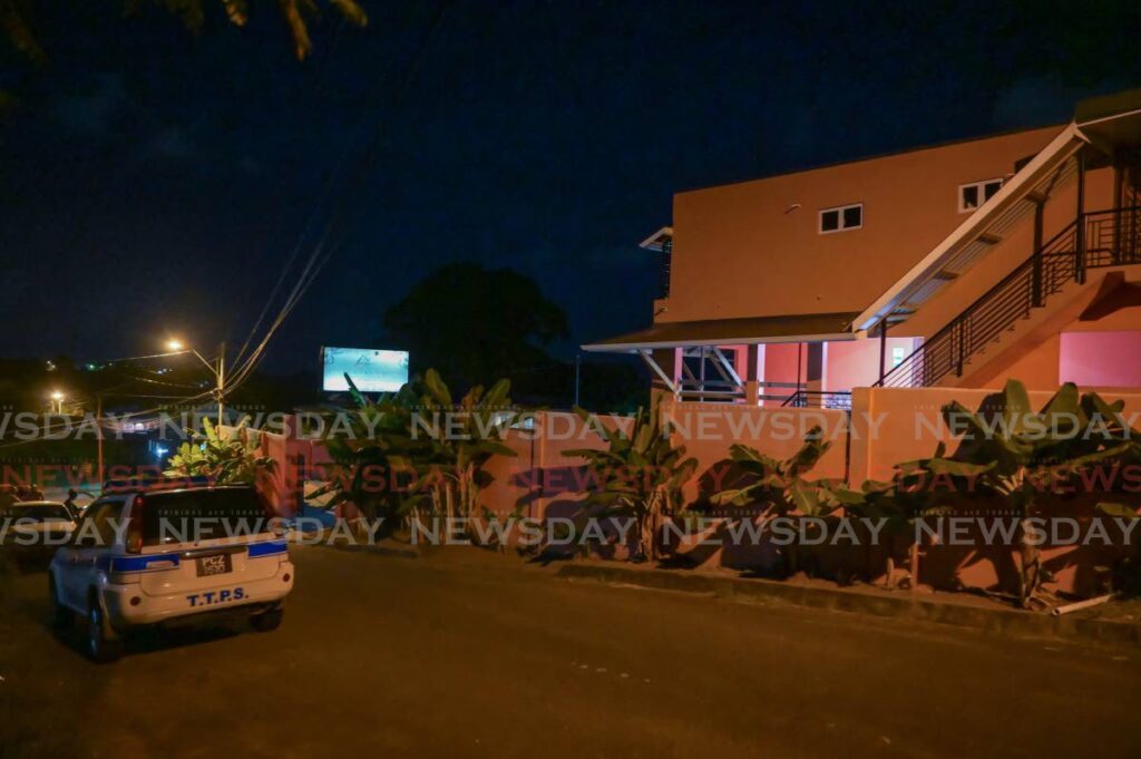 A police van is parked outside a guesthouse at Sou Sou Lands, Tobago on September 16, after two men were shot and killed by police. - Photo by Visual Styles