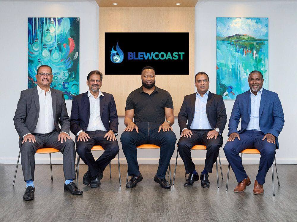 Nicholas Gomez, director, Blewcoast, left; Frank Teelucksingh, director and co-founder of Blewcoast; Keiron Pollard, former WI cricketer and GoElectric TT co-founder; Joel ‘Monty’ Pemberton, chairman and co-founder of Blewcoast; and Dinanath Ramnarine, former WI cricketer and co-founder of GoElectricTT. Photo courtesy Blewcoast. - 