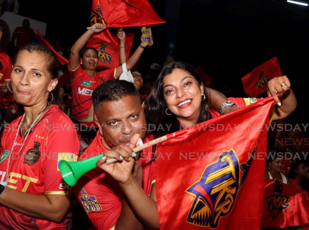 This couple shows their support for the Trinbago knight Riders during the CPL T20 match at the Queen's Park Oval, Port of Spain. - Photo by Ayanna Kinsale