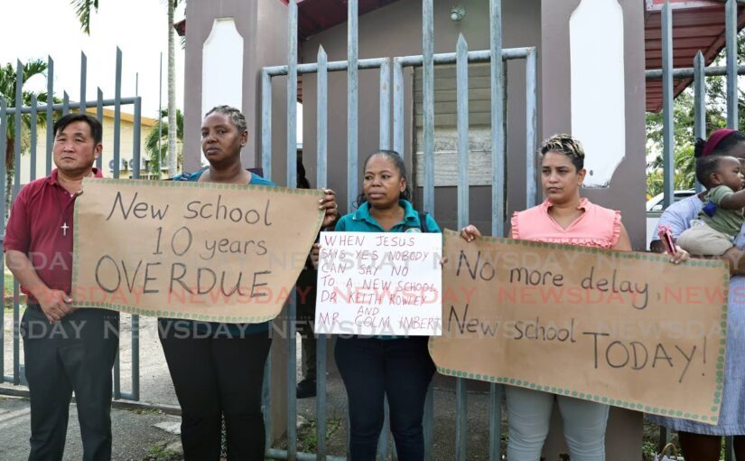 Frustrated members of the Parent Teacher Council of St Dominic's Penal RC School protest outside the school compound on September 19.