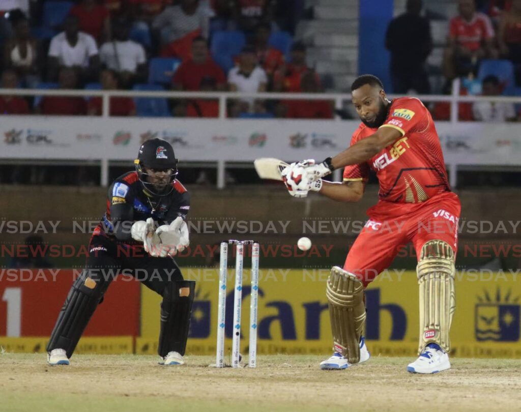 Trinbago Knight Riders batsman Kieron Pollard hits this shot to the boundary on September 19.  - Photo by Angelo Marcelle