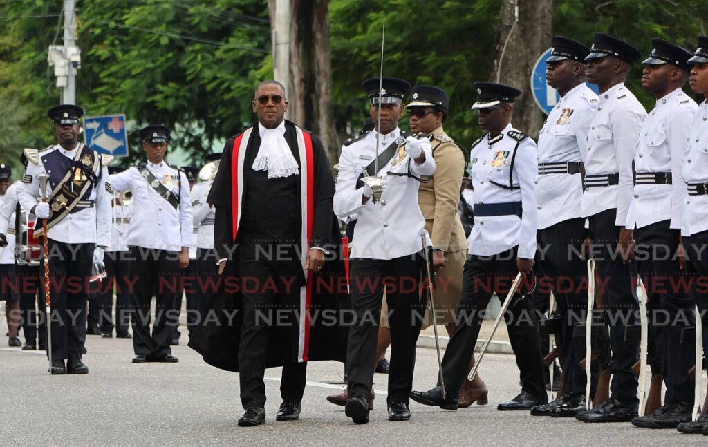 Chief Justice Ivor Archie is escorted by the inspection guard to parade display by the police service at the opening of the 2024-2025 law term at the National Academy for the Performing Arts, Port of Spain on September 20.  - Photo by Roger Jacob