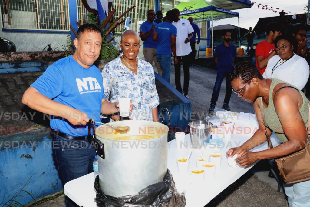 National Transformation Alliance (NTA) political leader Gary Griffith, his wife Nicole Dyer-Griffith and NTA national executive members and supporters get ready to greet passersby and motorists for their Soup and Chat pavement lime at the NTA’s St Joseph office on the Eastern Main Road in Mt Lambert on September 20.  - ROGER JACOB