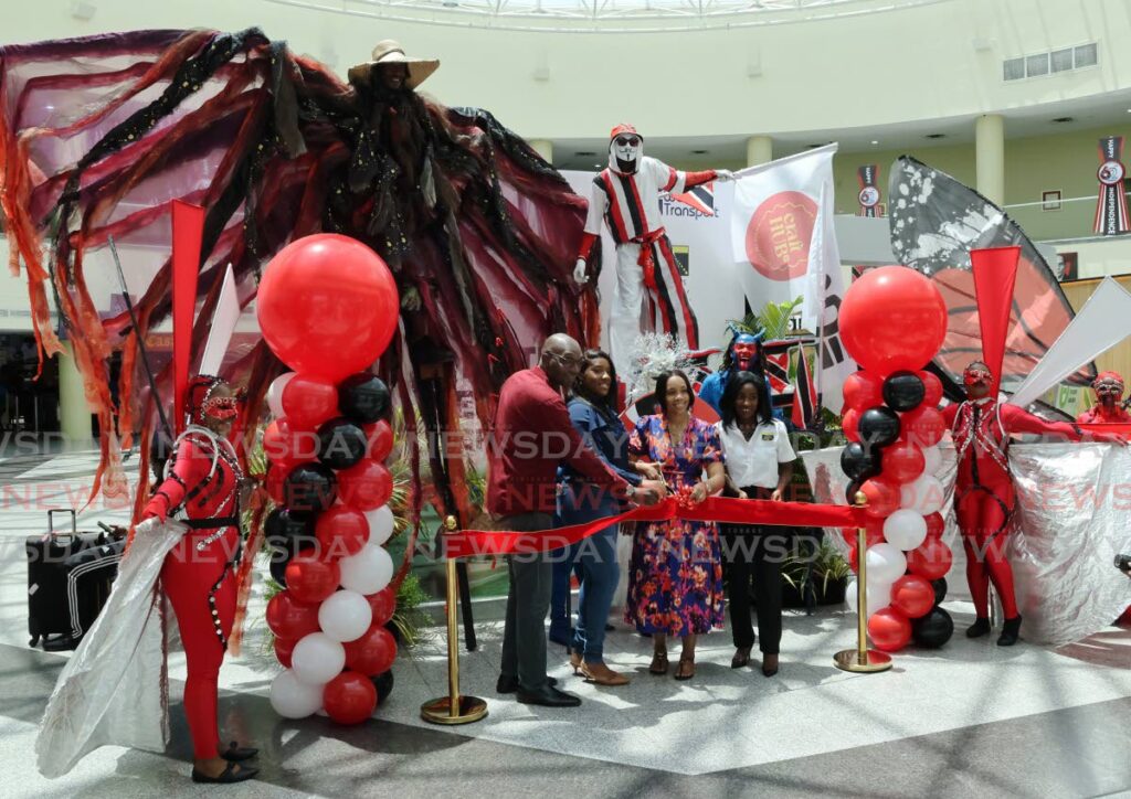 From left, ECCL CEO Adwin Cox, ECCL director Markia Trim, ECCL deputy chairman Nathifa Carr and AATT corporate communication manager Zola Joseph cut the ribbon at the opening of the Craft Hub TT National Republic Day Craft Market hosted by Export Centres Company Ltd in collaboration with the Airports Authority of TT held at the Piarco International Airport on September 21. - Photo by Roger Jacob