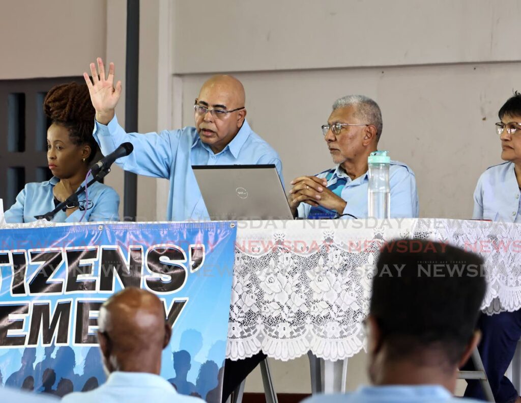 MSJ chairman Gregory Fernandez makes a point while MSJ political leader David Abdulah looks on at the MSJ's Citizen Assembly held at the Preysal Secondary School, Couva on September 21. - Photo by Lincoln Holder