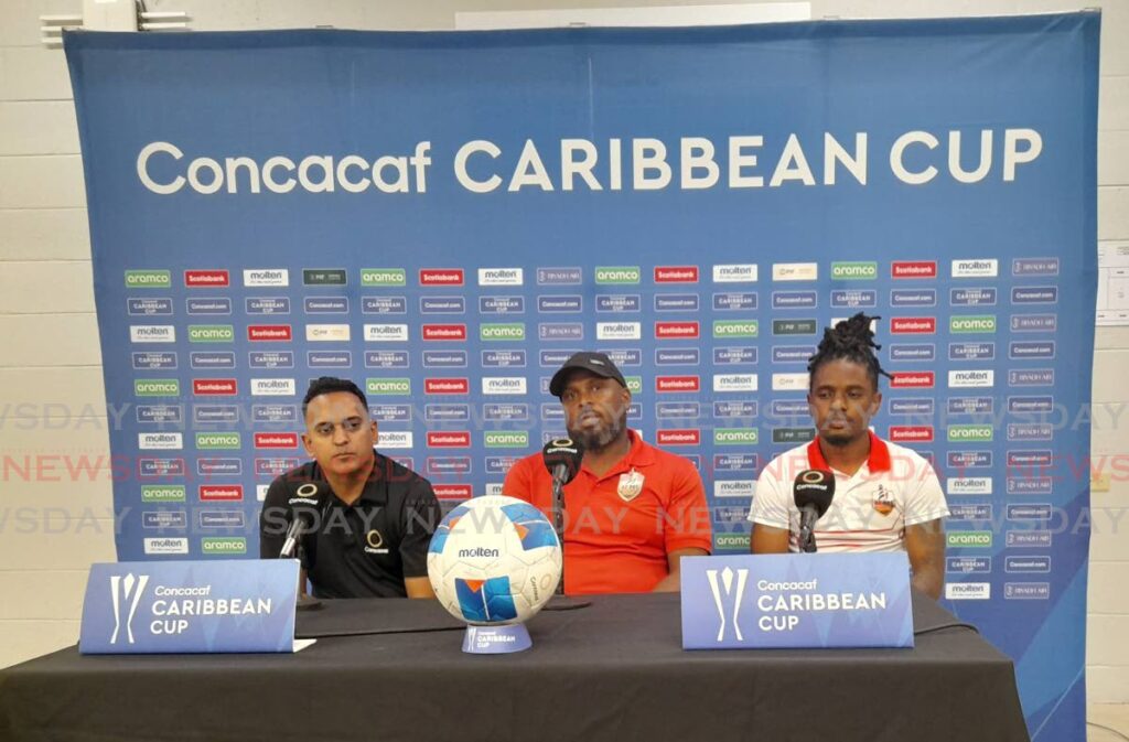 AC PoS coach Walt Noriega (centre) and captain Duane Muckette (right) address the media at a press briefing at the Hasely Crawford Stadium, Mucurapo on September 23. Photo by Roneil Walcott.  - 