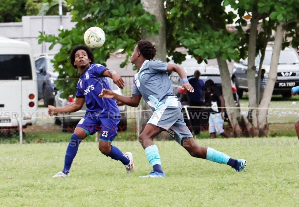 Naparima College’s Arron Raymond (L) and Arima North Secondary’s Jaquan Aquilleira battle for control of the ball, during the Secondary Schools Football League match, on September 25, 2024 at Lewis Street, San Fernando.  - Lincoln Holder 