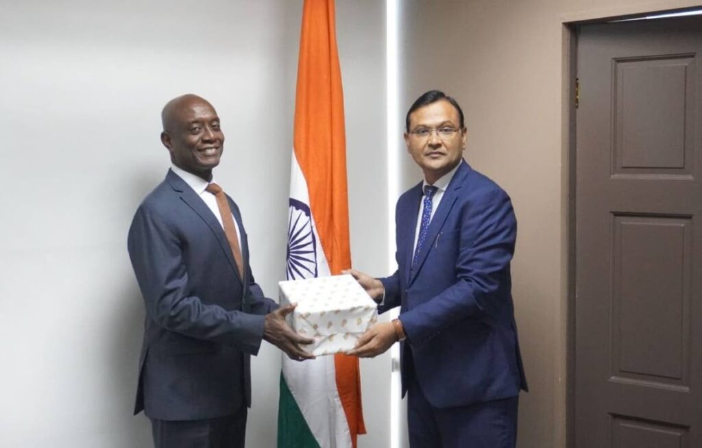 Central Bank Governor Dr Alvin Hilaire, left, is presented a token by Pradeep Singh Rajpurohit, High Commissioner of India.
Photo courtesy High Commission of India - 