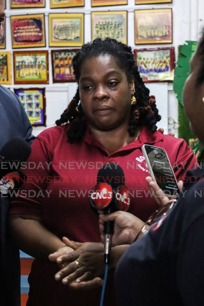 TRAUMATISED: Roxann's Learning and Childhood Centre Principal Roxann King speaks with reporters at the preschool on Friday, two days after gunplay outside the Malick school left two men dead and three other people wounded. - Photo by Gabriel Williams