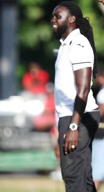 FILE PHOTO: QRC coach Kenwyne Jones giving his players instructions during a previous season in the Secondary Schools Football League. - 