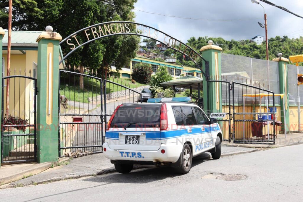 Officers of the Police Victim and Support Unit arrive for their visit to St. Francois Girls College after the recent shooting which took place near the school. - Photo by Gabriel Williams