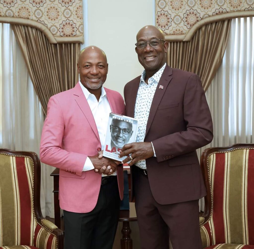 The Prime Minister received a courtesy call from cricket legend Brian Lara at Whitehall, Port of Spain on September 19. Lara presented Rowley with a signed copy of his new memoir, Lara: The England Chronicles. -Photo courtesy the PM's Facebook page