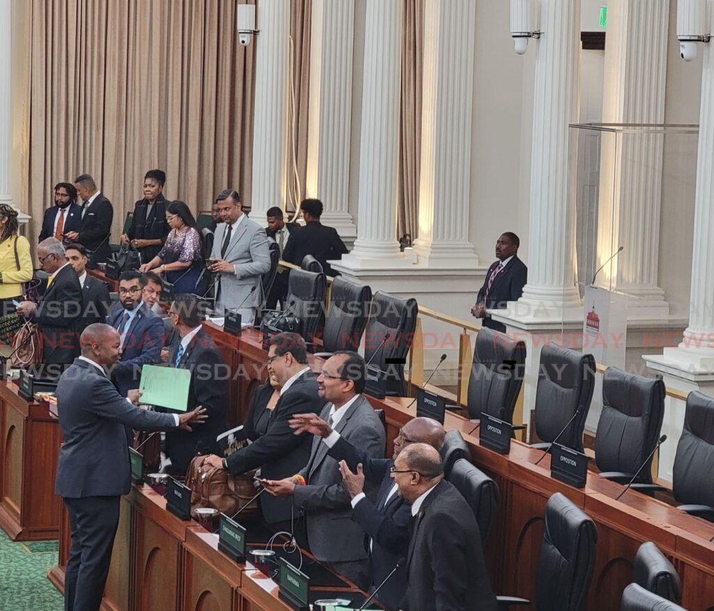 Minister of Youth Foster Cummings engages in conversation with opposition MPs Anita Haynes, Rushton Paray, and Dinesh Rambally during a session at the House of Representatives, Red House, Port of Spain, on September 9. - Photo by Krisann Durity