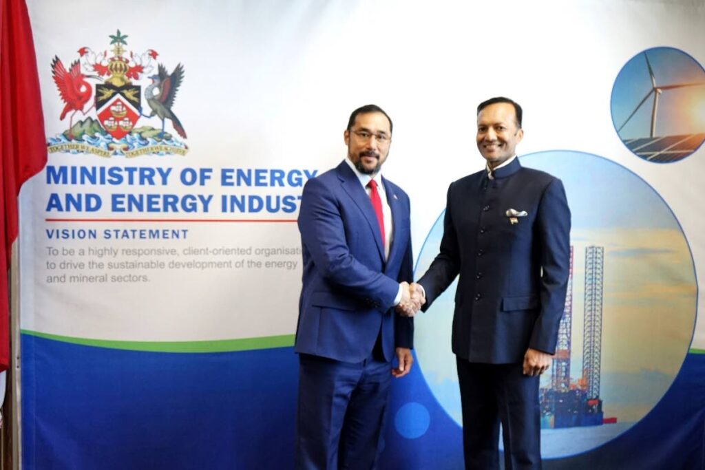 Energy Minister Stuart Young, left, greets Naveen Jindal, chairman of Jindal Steel and Power company of India, during a courtesy call to the minister earlier this year. PHOTO COURTESY MINISTRY OF ENERGY - 