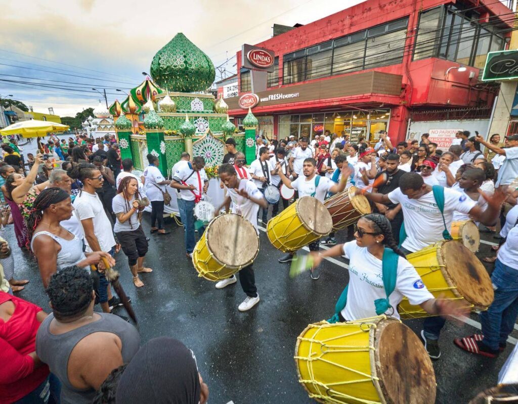 People participate in Hosay festivities in St James. - File photo by Mark Lyndersay - Mark Lyndersay