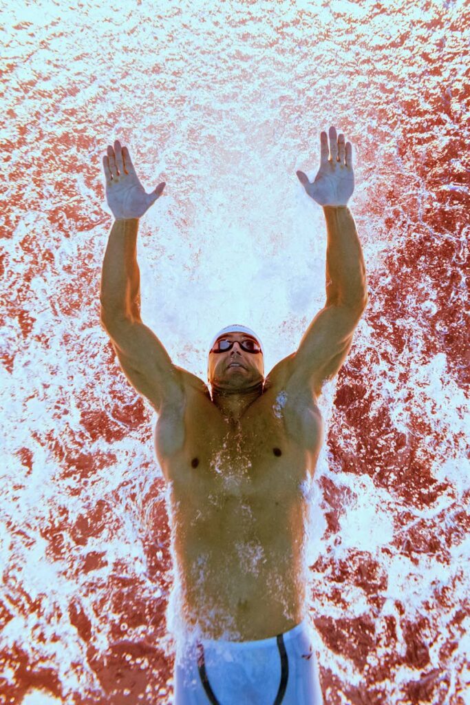 Trinidad and Tobago's Dylan Carter competes in the men's 50m butterfly during the 2024 World Aquatics Championships at Aspire Dome in Doha on February 12, 2024.  - 