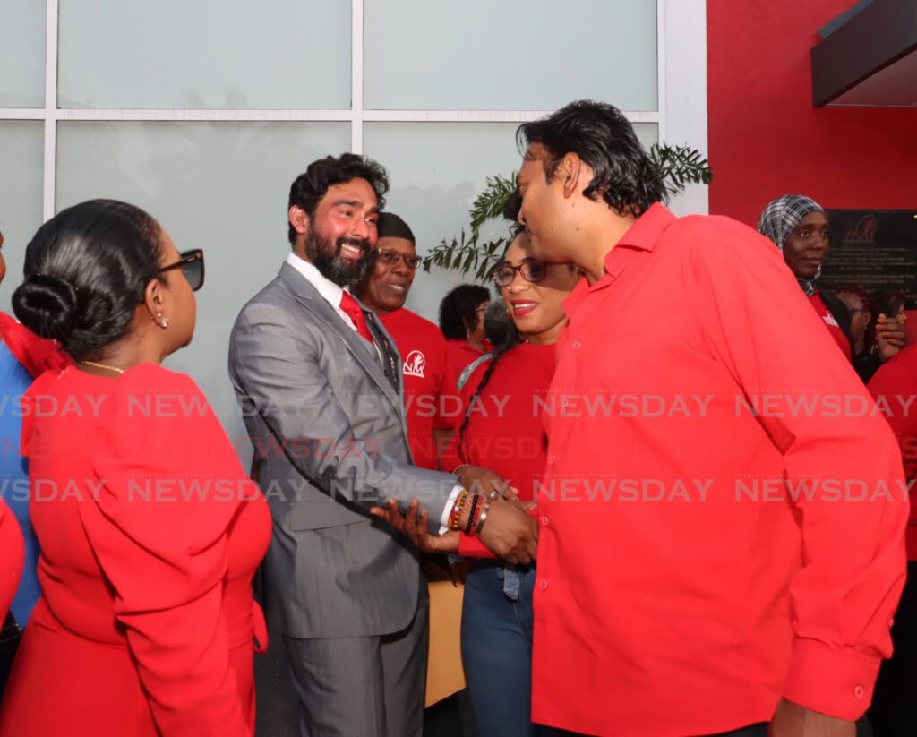 Richie Sookhai, the PNM's candidate Chaguanas East, greets Mahindra Rampersad, field officer, at the PNM's screening exercise, Balisier House, Port of Spain on August 26. The PNM on October 3 announced the selection of six more candidates for the general election constitutionally due in 2025. - Photo by Faith Ayoung