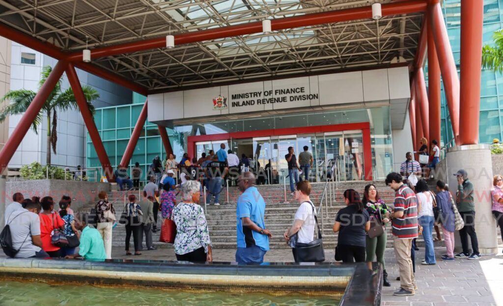 Dozens of residents form long lines to pay their property taxes at the Ministry of Finance, Inland Revenue Division, Wrightson Road, Port of Spain on September 12, 2024. - File photo