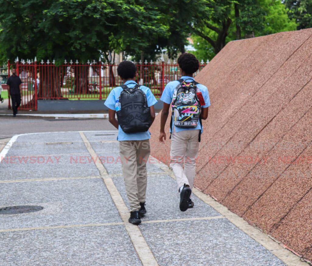 St Mary's College students walk along Pembroke Street, Port of Spain recently. - Photo by Gabriel Williams