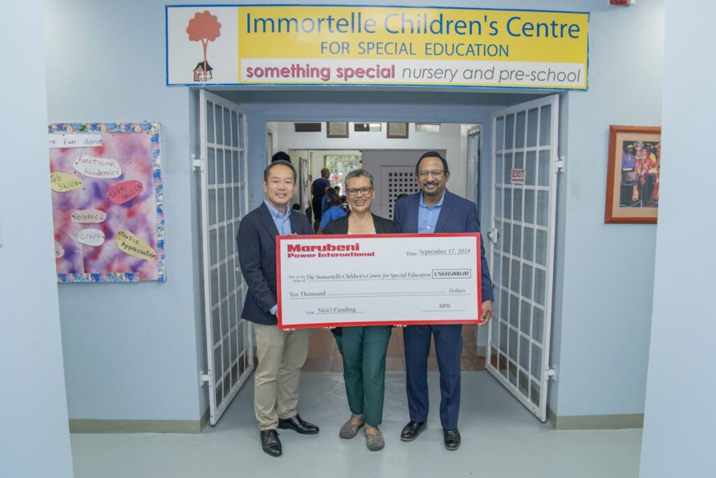  Senior manager Marubeni Power International Inc Keisuke Harada, left, and COO/ managing director Marubeni Power International Inc Mo Majeed, right, present the principal of Immortelle Children’s Centre for Special Education Charlene Gittens with a donation of US$10,000 on September 17.   - 