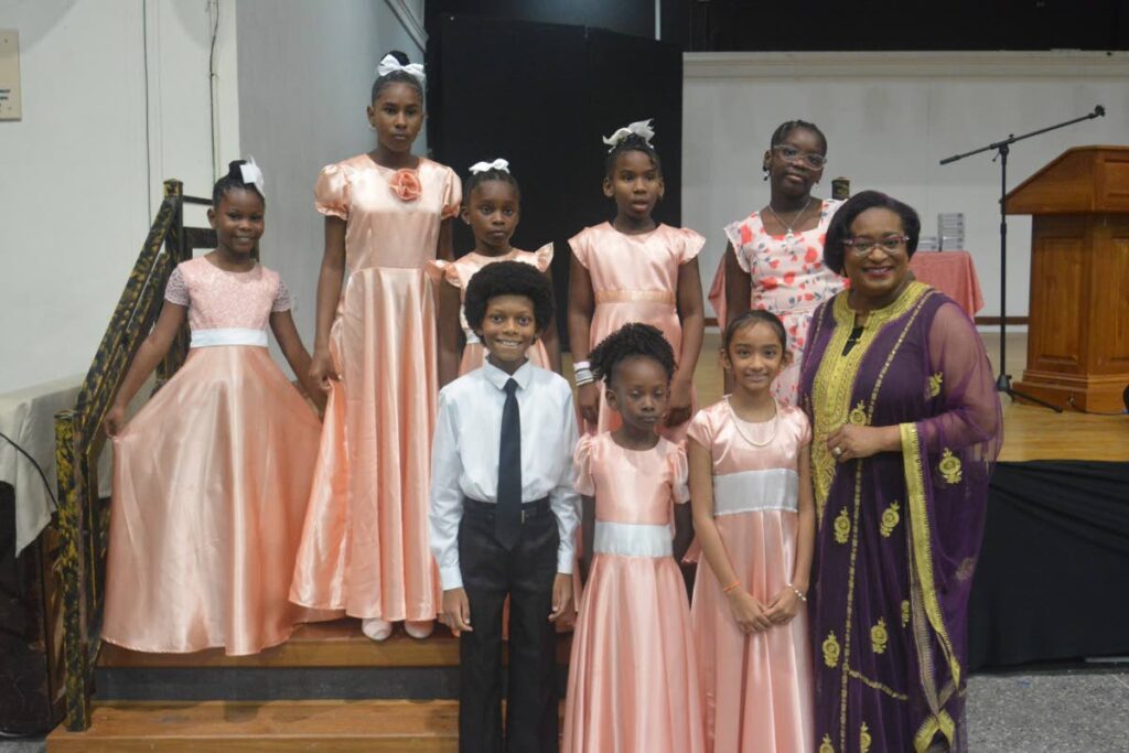 Debra Jean-Baptiste-Samuel, right, with some graduates of the Oratory Foundation.  In back row are Zephaniah Joseph, left, Angel Kinsale, Olayinka Walker-Trotman, Zhane Phillip and Makaylah Roberts. Front row: Luke Sebastian Holder, Thais Jean-Baptiste and Avni Maharaj. - 