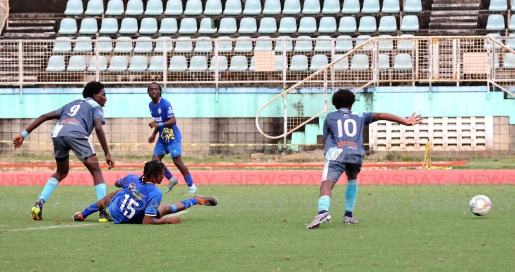 In this photo taken on October 2, 2024, players scramble for the ball during the SSFL Premiership Division match between Arima North Secondary (grey) and Presentation College, San Fernando, at the Manny Ramjohn Stadium in Marabella on October 2. - File photo