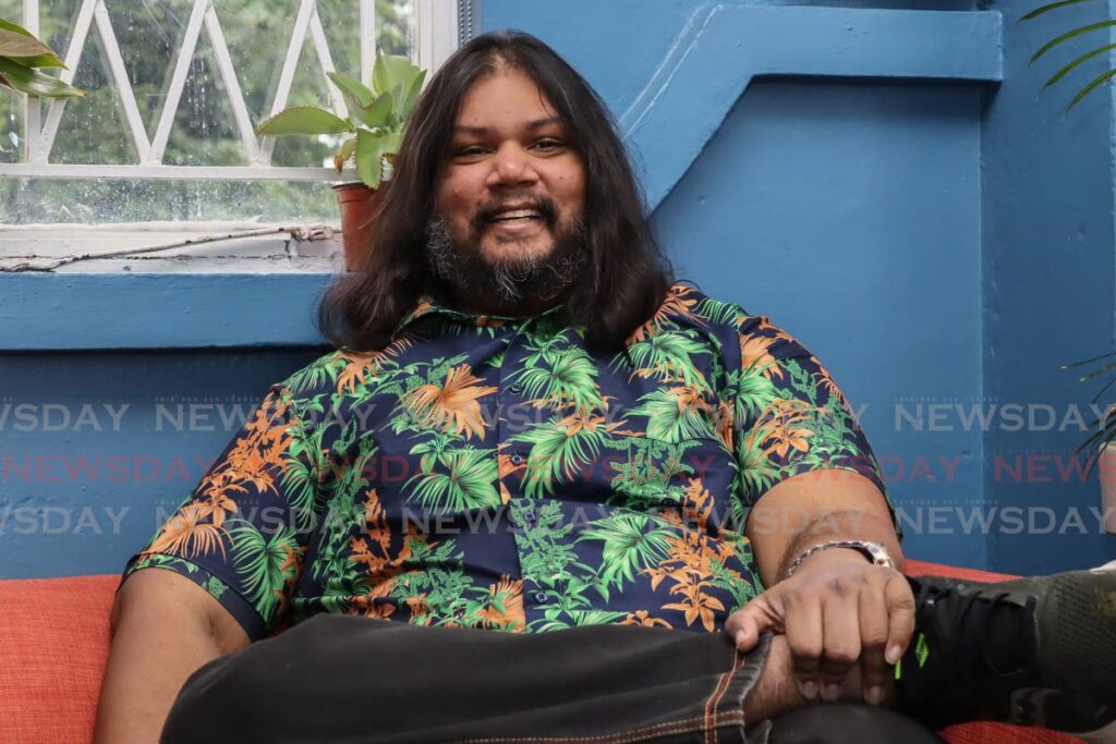 Author Kevin Jared Hosein smiles as he speaks to Newsday ahead of his European tour at the Noir Coffee Lab, Austin Street, St Augustine on October 3. - Photo by Gabriel Williams