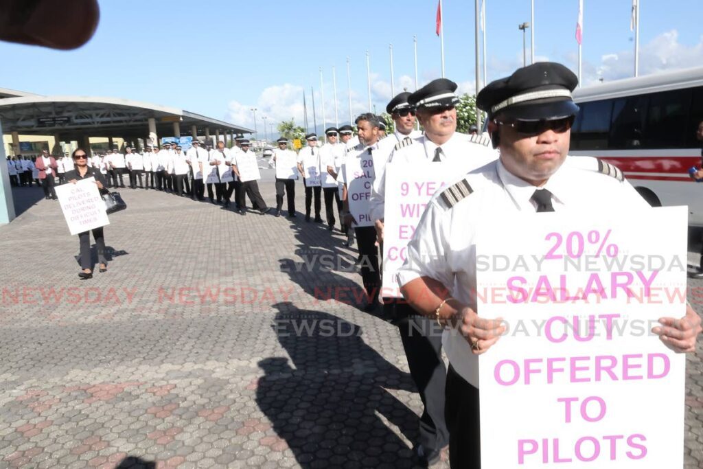 Caribbean Airlines pilots who are members of the TT Airline Pilots Association (TTALPA) protest at the Piarco International Airport on October 3. - Roger Jacob