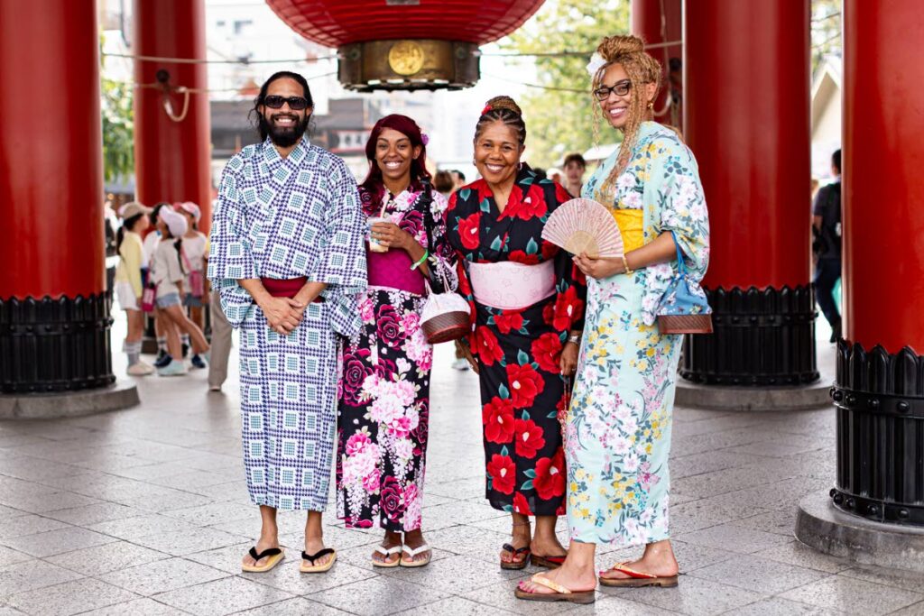 Patrons of Soca In Japan enjoy a tour of Asakusa Senso-ji Buddhist Temple and shopping street in Tokyo. Members of the tour were able to dress in kimonos during the tour. The kimono is a traditional Japanese garment and the national dress of Japan. - Photo courtesy SIJ