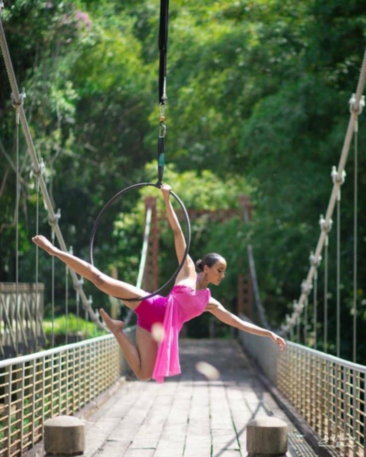 Aerial dancer Sade Ellis displaying her hoop skills at Blanchisseuse bridge. Photo courtesy Sade Ellis. - 