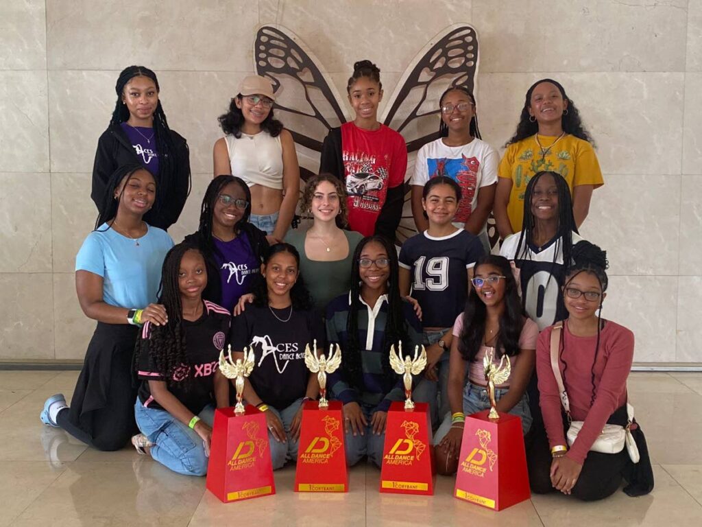 ACES Dance Academy dancers pose with their four first-place trophies at El Hotel Panama in Panama City. - 