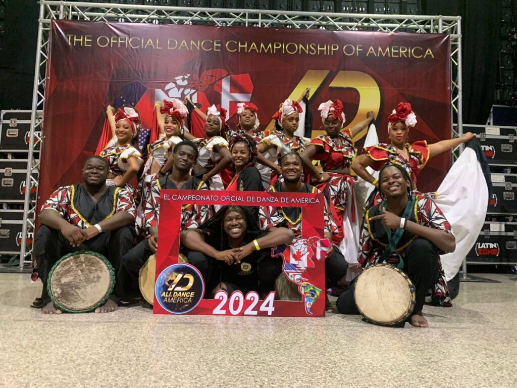 St George's College Dancers at the All Dance America competition in Panama.  Along with them are Anna Roberts, the school's music teacher, Kenson Laudat, their dance instructor/choreographer, and drummers from the Chaguanas Women and Youth Group. PHOTO COURTESY ROBERTS - 