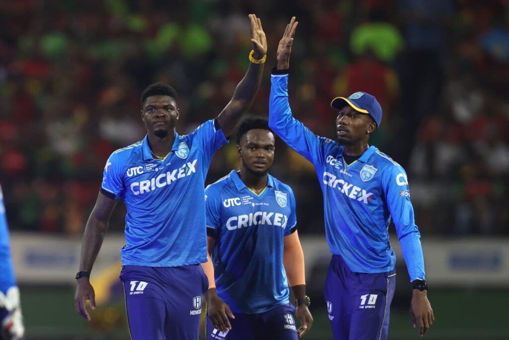 Alzarri Joseph (L) and Khary Pierre (R) of St Lucia Kings celebrate a wicket during the CPL. - (CPL T20)