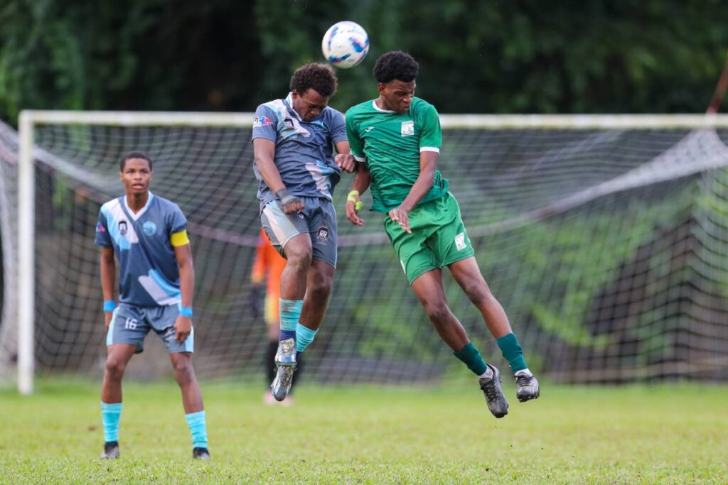 Arima North Secondary Criston Gomez (L) vies with a San Juan North midfilder to claim the header during the SSFL Premiership match at the San Juan North Secondary on October 5, in San Juan. San Juan take on Speyside Secondary on October 21 in San Juan.  - Daniel Prentice