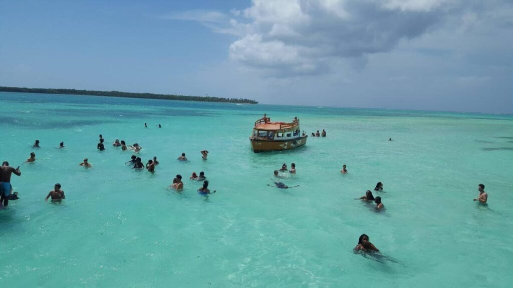 First Try, a glass-bottom boat, carries visitors to the famous Nylon Pool. - Photo by Shivonne Peters-McPherson