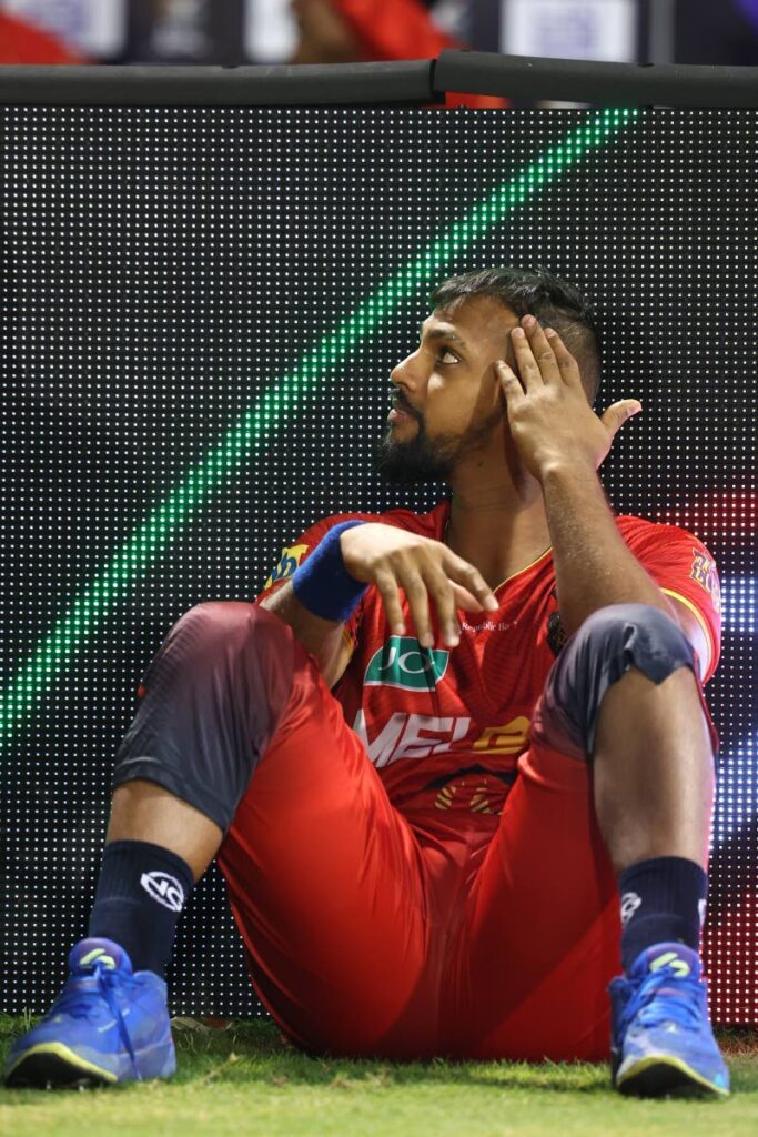 Trinbago Knight Riders wicketkeeper-batsman Nicholas Pooran waits as a faulty floodlight causes a delay in play during the 2024 Republic Bank Caribbean Premier League eliminator match against Barbados Royals at Providence Stadium on October 1, 2024 in Georgetown, Guyana - (CPL T20)