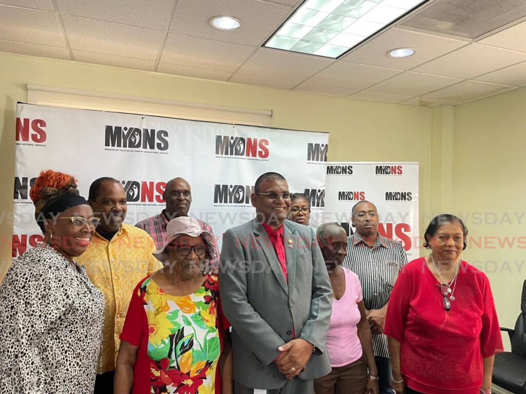 The Ministry of Youth Development and National Services (MYDNS) hosted a cheque presentation event on October 8 at their St Claire headquarters. Cheque recipeients pose with MYDNS permanent secretary, Narine Charran. - Photo by Tia-Marie Lander