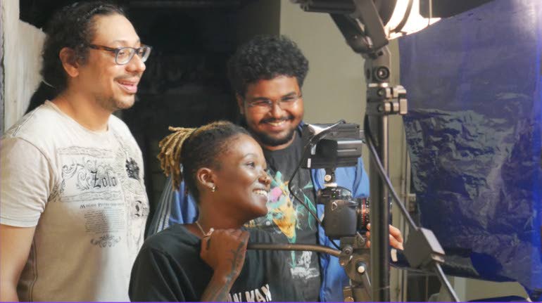 Forward Ever Foundation chairman Christopher Din Chong, left, works with the next generation of filmmakers during the Caribbean Pitch Tank. - 