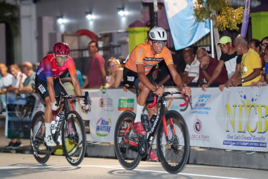 Colombia's Mateo Garcia (R) wins the main event of the annual Cycling on the Avenue, on October 9, at Ariapita Avenue, Port of Spain. - Photo by Daniel Prentice