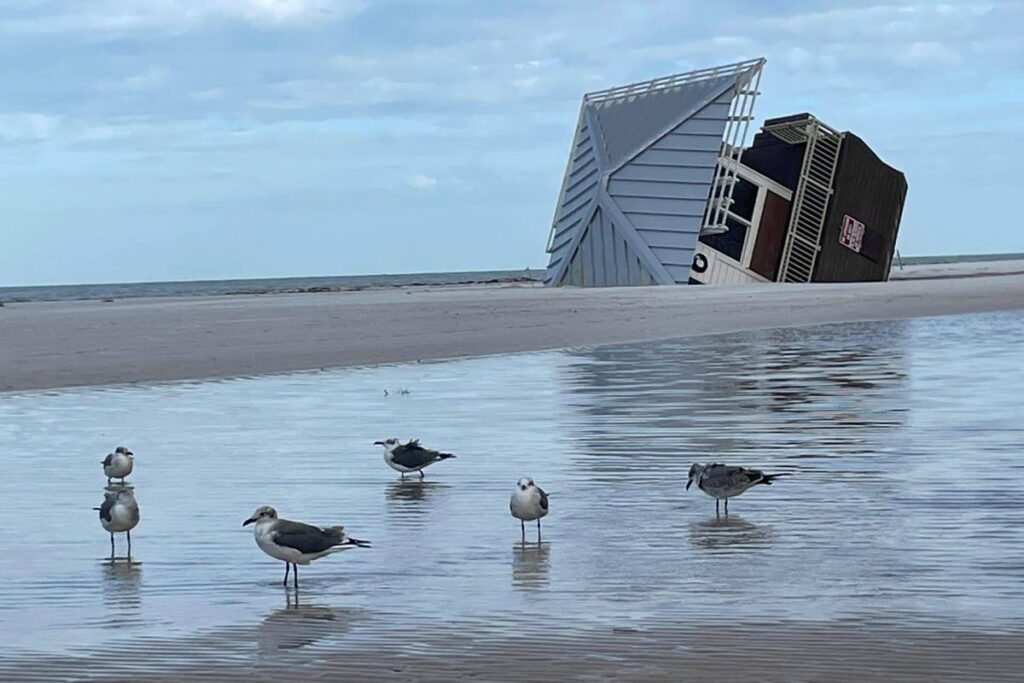 A lifeguard hut is on its side after Hurricane Milton at Clearwater Beach, Florida., on October 11. Hurricane Oscar was heading to Turks and Caicos, Bahamas and Cuba on October 19. - AP Photo