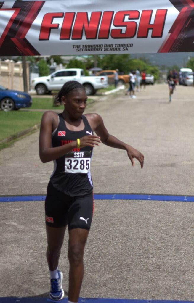 Successful Shian: Success Laventille Secondary School's Shian Lewis crosses the line in top spot in the girls' category at the Secondary Schools Track and Field North Region 5K in Malabar on October 10. - Photo courtesy Holy Cross College photography