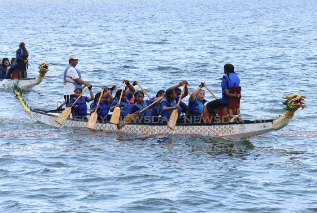 HNC Water Dragons paddle back to shore after placing third in their heat at the 17th annual Chinese Bicentennial Dragon Boat Festival at Chaguaramas Boardwalk on October 12, 2024. - Photo by Faith Ayoung