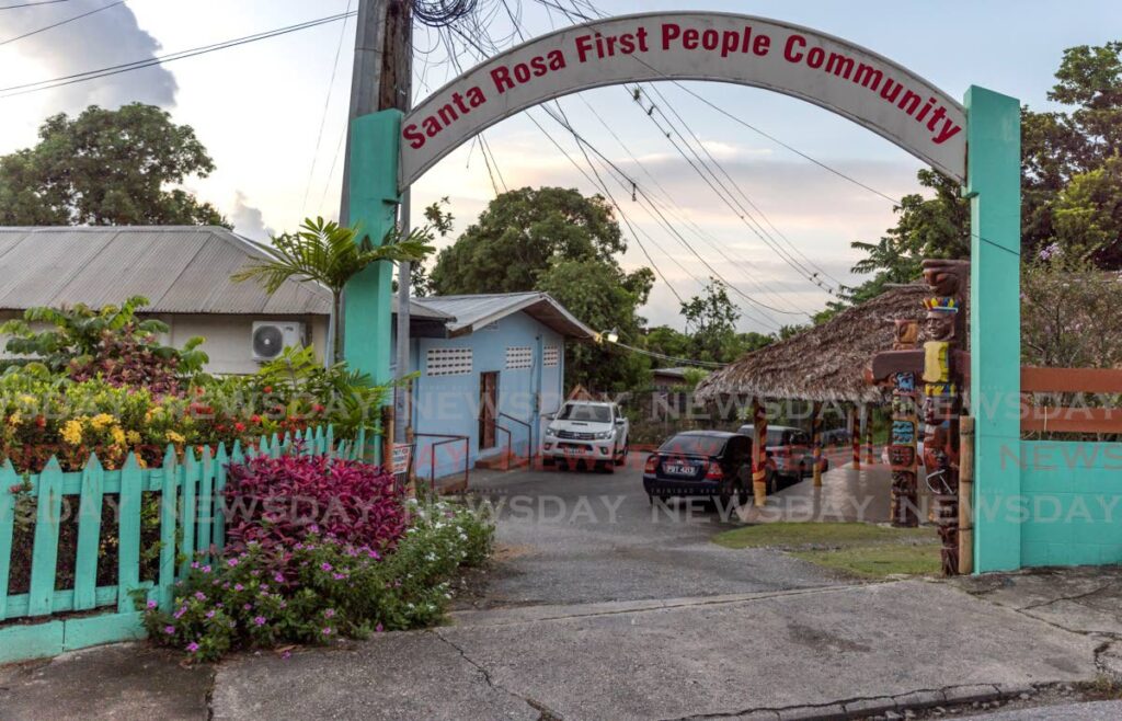 The entrance to the Santa Rosa First Peoples Community Centre on Paul Mitchell Street, Arima, featuring totem poles, each telling a unique story of heritage and tradition. FILE PHOTO/JEFF MAYERS - 