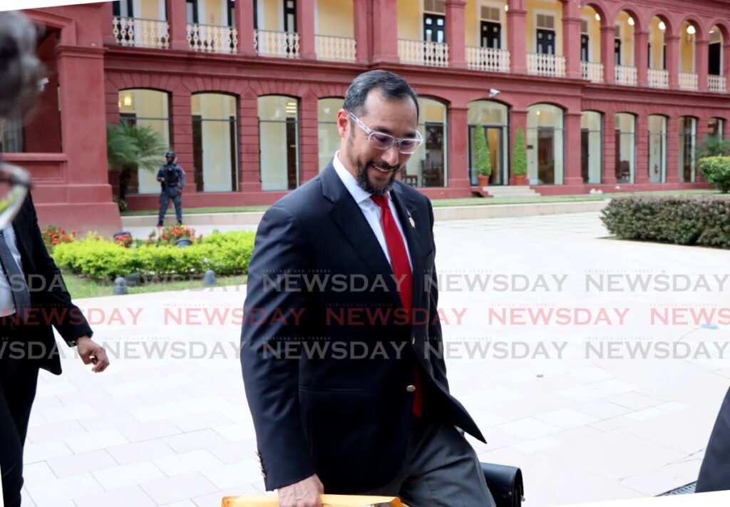 SILENT: Energy Minister Stuart Young smiles as he leaves the Red House after the Standing Finance Committee meeting ended for the day on Monday. PHOTO BY AYANNA KINSALE - AYANNA KINSALE