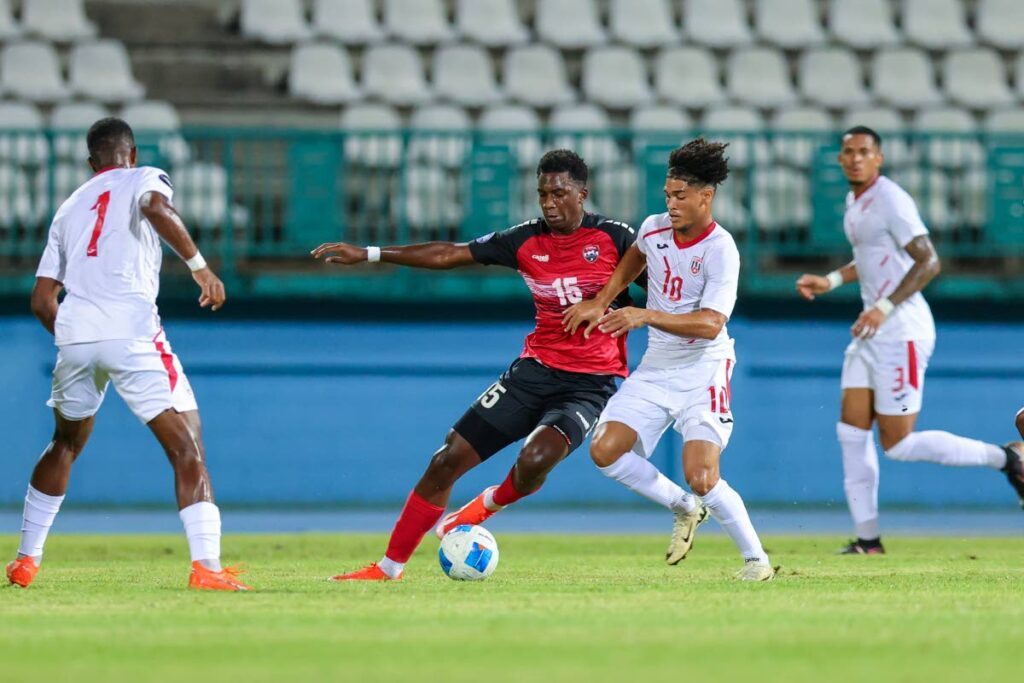 Trinidad and Tobago's Dantaye Gilbert (15) tries to maintain control of the ball against Cuba during their Concacaf Nations League match, at the Dwight Yorke Stadium, Bacolet, Tobago, on October 14, 2024.  - Daniel Prentice