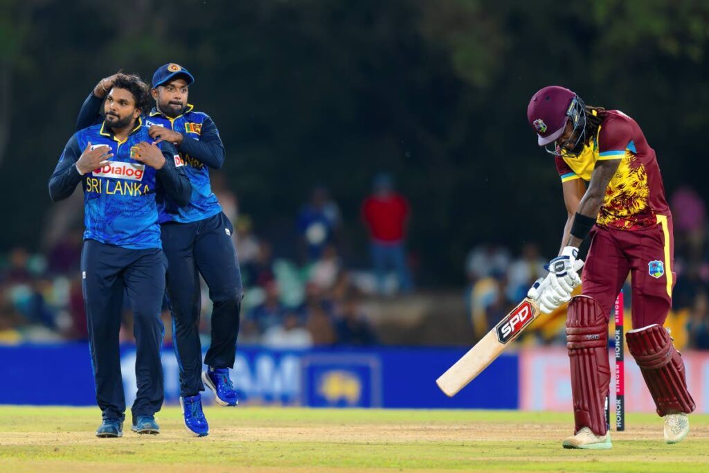 Sri Lanka's Wanindu Hasaranga, left, celebrates the wicket of West Indies batsman Sherfane Rutherford during the second Twenty20 cricket match in Dambulla, Sri Lanka,October 15. - AP