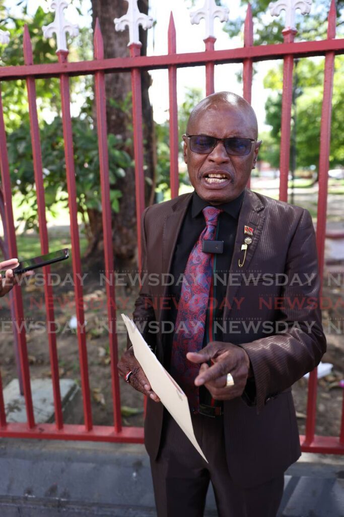 Activist Wendell Eversley demands an apology from Energy Minister Stuart Young and Finance Minister Colm Imbert during a press conference in front of the Red House, Port of Spain, on October 15.
 - Photo by Jeff K. Mayers