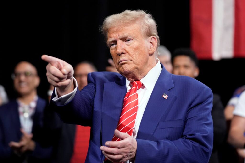 Republican presidential nominee former President Donald Trump gestures at a campaign event at the Cobb Energy Performing Arts Centre, in Atlanta, on October 15. AP PHOTO - 